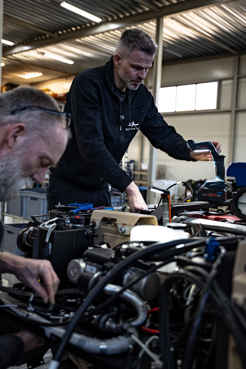 Workers inspect engine components on a GRF light tactical vehicle on the production line. As NATO members ramp up defence spending, Europe’s defence industrial base is stepping up to meet demand. Defenture, a defence company founded in 2013 and headquartered in Tiel, the Netherlands, specialises in producing light tactical mobility solutions. Vehicles designed not just for transport, but for survivability and flexibility. 
Engineers, technicians, and assembly teams work side by side, transforming raw components into mission-ready vehicles, including the lightweight and maneuverable GRF and the powerful Mammoth. These vehicles are destined for use with various NATO allies including Germany and Lithuania.