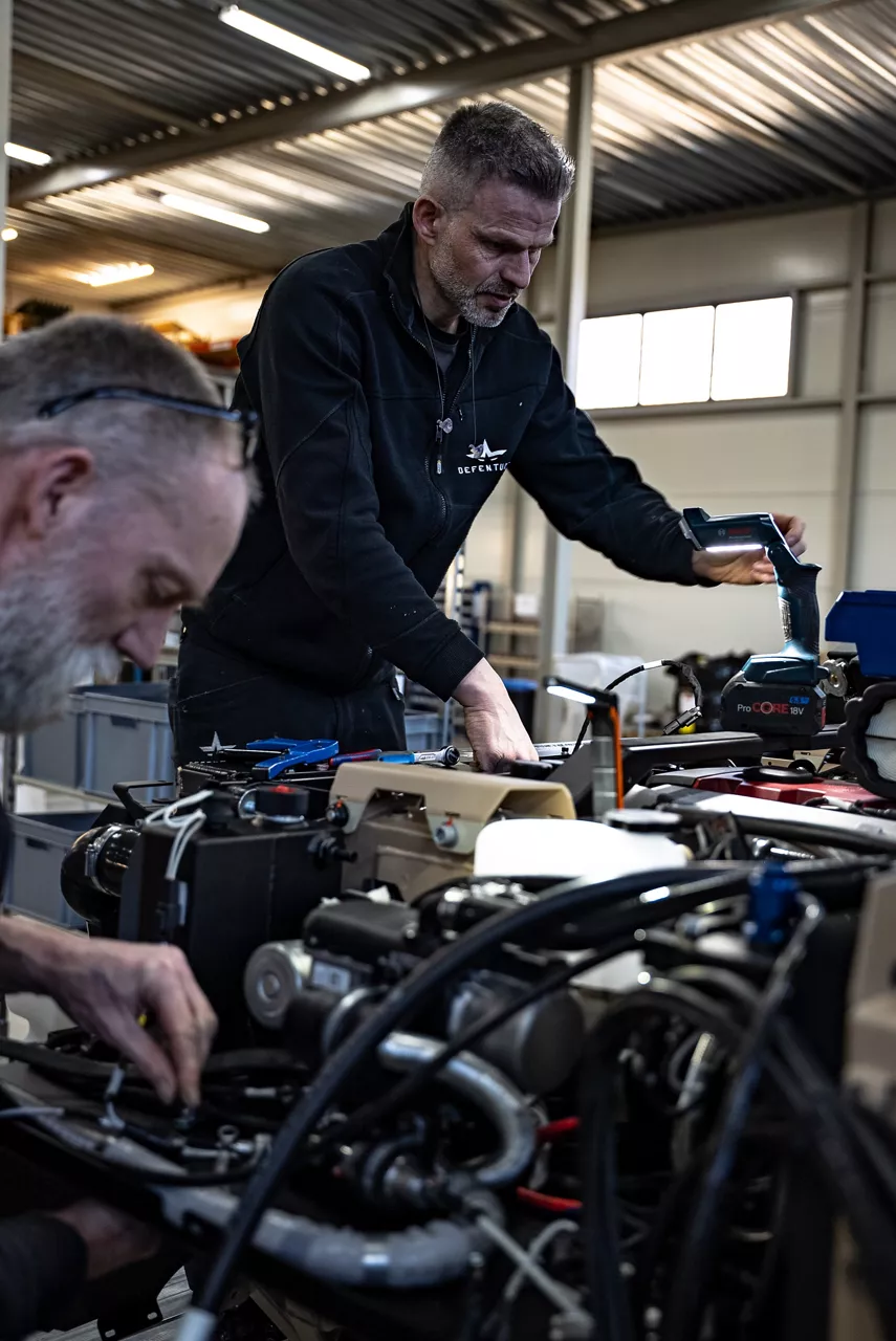 Workers inspect engine components on a GRF light tactical vehicle on the production line. As NATO members ramp up defence spending, Europe’s defence industrial base is stepping up to meet demand. Defenture, a defence company founded in 2013 and headquartered in Tiel, the Netherlands, specialises in producing light tactical mobility solutions. Vehicles designed not just for transport, but for survivability and flexibility. 
Engineers, technicians, and assembly teams work side by side, transforming raw components into mission-ready vehicles, including the lightweight and maneuverable GRF and the powerful Mammoth. These vehicles are destined for use with various NATO allies including Germany and Lithuania.