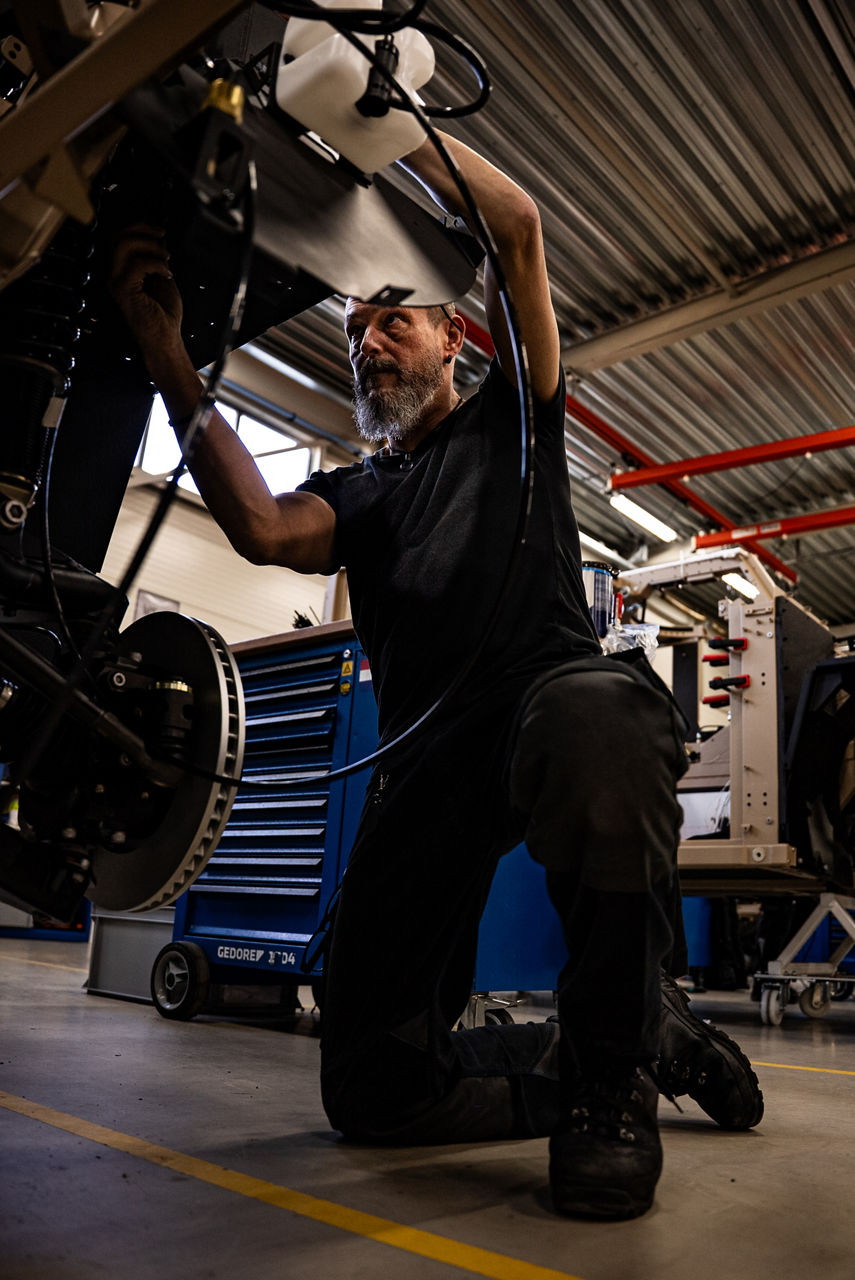 A worker constructing a GRF light tactical vehicle on the production line. As NATO members ramp up defence spending, Europe’s defence industrial base is stepping up to meet demand. Defenture, a defence company founded in 2013 and headquartered in Tiel, the Netherlands, specialises in producing light tactical mobility solutions. Vehicles designed not just for transport, but for survivability and flexibility. 
Engineers, technicians, and assembly teams work side by side, transforming raw components into mission-ready vehicles, including the lightweight and maneuverable GRF and the powerful Mammoth. These vehicles are destined for use with various NATO allies including Germany and Lithuania.