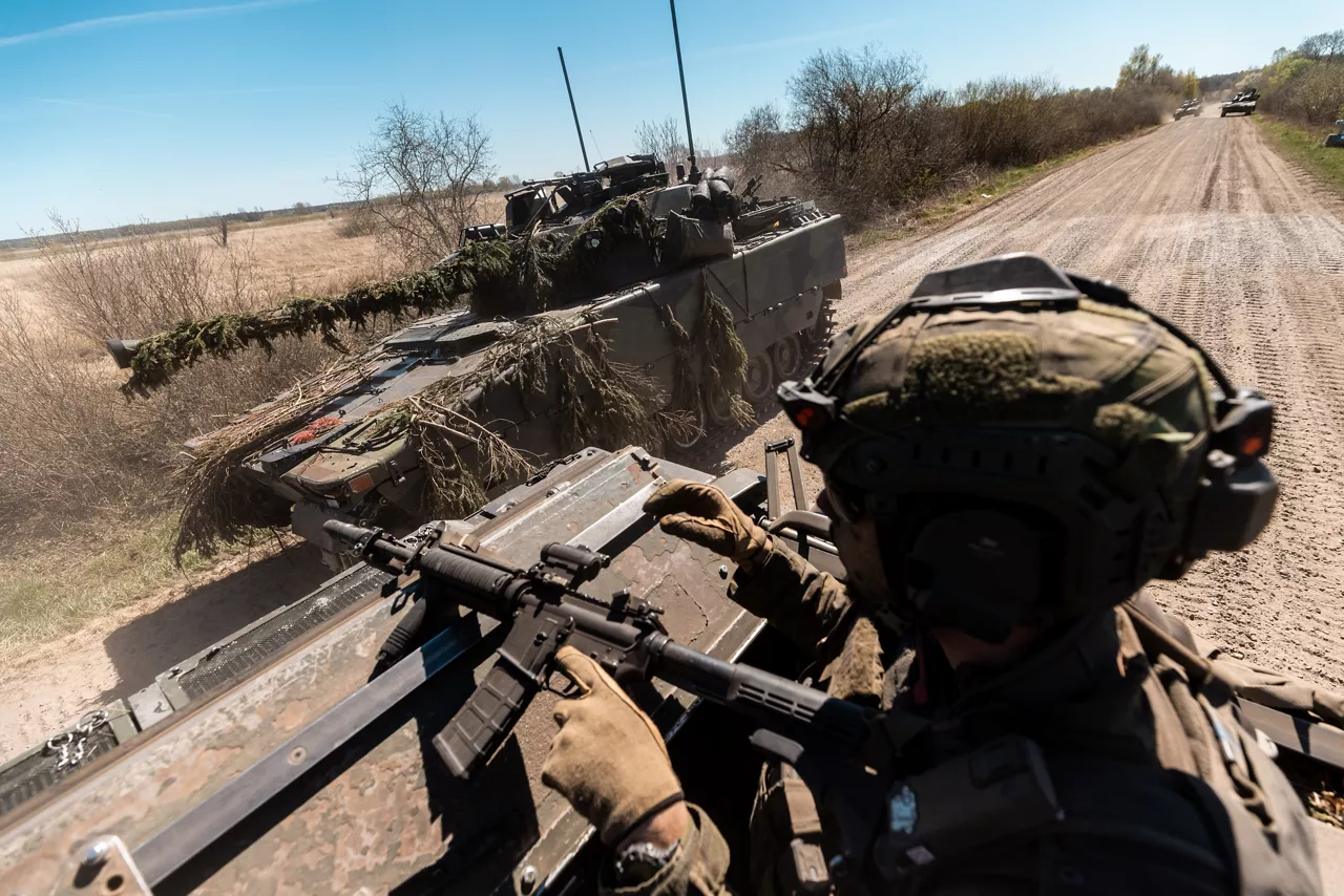 A soldier with the Swedish Army’s South Skåne Regiment driving in a CV90 Infantry Fighting Vehicle near Revingehed, Sweden during Exercise Aurora 26. Past iterations of Aurora, Sweden’s largest military exercise series, focused on mobilising the country’s armed forces for national defence. This year’s iteration also set out to test Sweden’s ability to incorporate Allied forces in those plans. More than 18,000 soldiers from 13 countries participated.