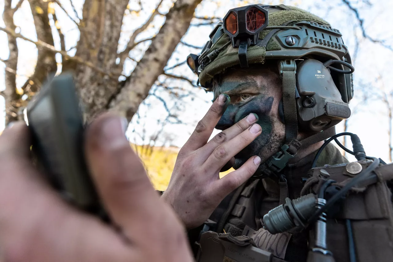 A soldier with the Swedish Army’s South Skåne Regiment applies camouflage face paint near Revingehed, Sweden during Exercise Aurora 26. Past iterations of Aurora, Sweden’s largest military exercise series, focused on mobilising the country’s armed forces for national defence. This year’s iteration also set out to test Sweden’s ability to incorporate Allied forces in those plans. More than 18,000 soldiers from 13 countries participated.