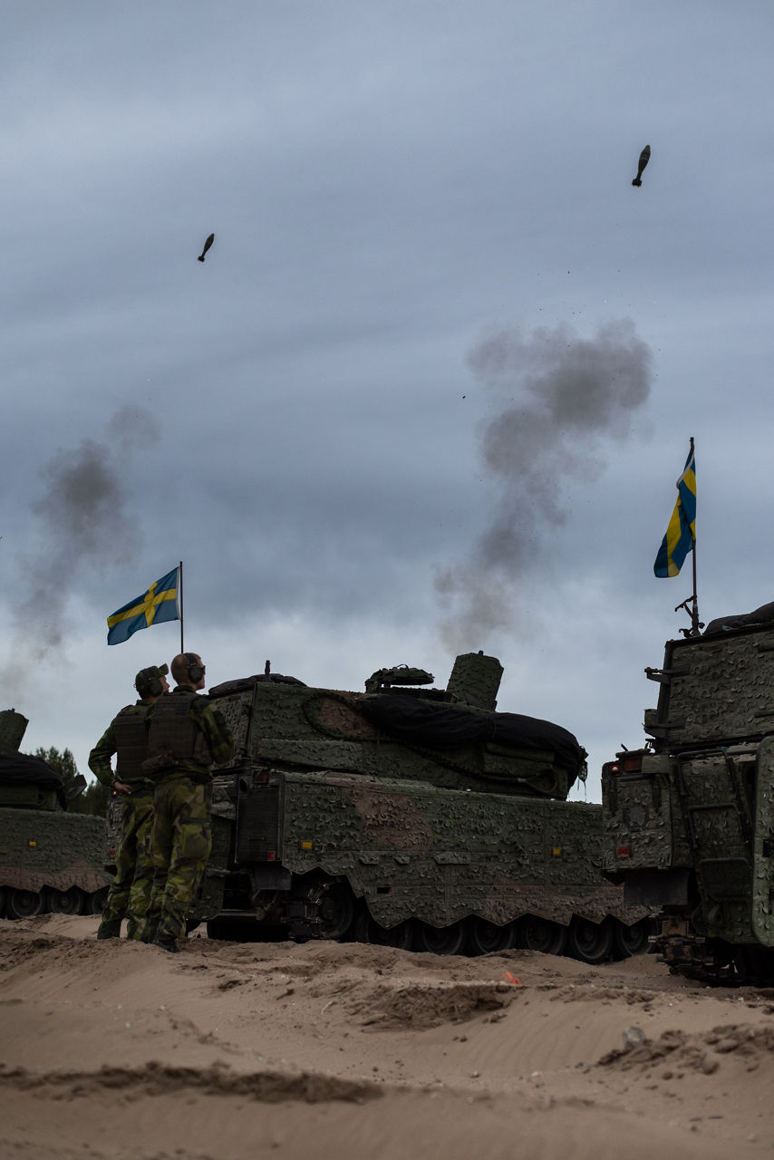 Swedish Army CV90 Infantry Fighting Vehicles equipped with 120mm mortars conducting a live fire exercise at Camp Ādaži in Latvia during exercise Aurora 26. Past iterations of Aurora, Swedish-led military exercise series, focused on mobilising the country’s armed forces for national defence, this year’s iteration also set out to test Sweden’s ability to incorporate Allied forces in those plans. Part of the exercise saw an armoured battalion from the South Skåne Regiment deploy to Latvia for training, while using the same transportation and logistics methods that might be used to reinforce NATO Allies in times of crisis. More than 18,000 soldiers from 13 countries participated.