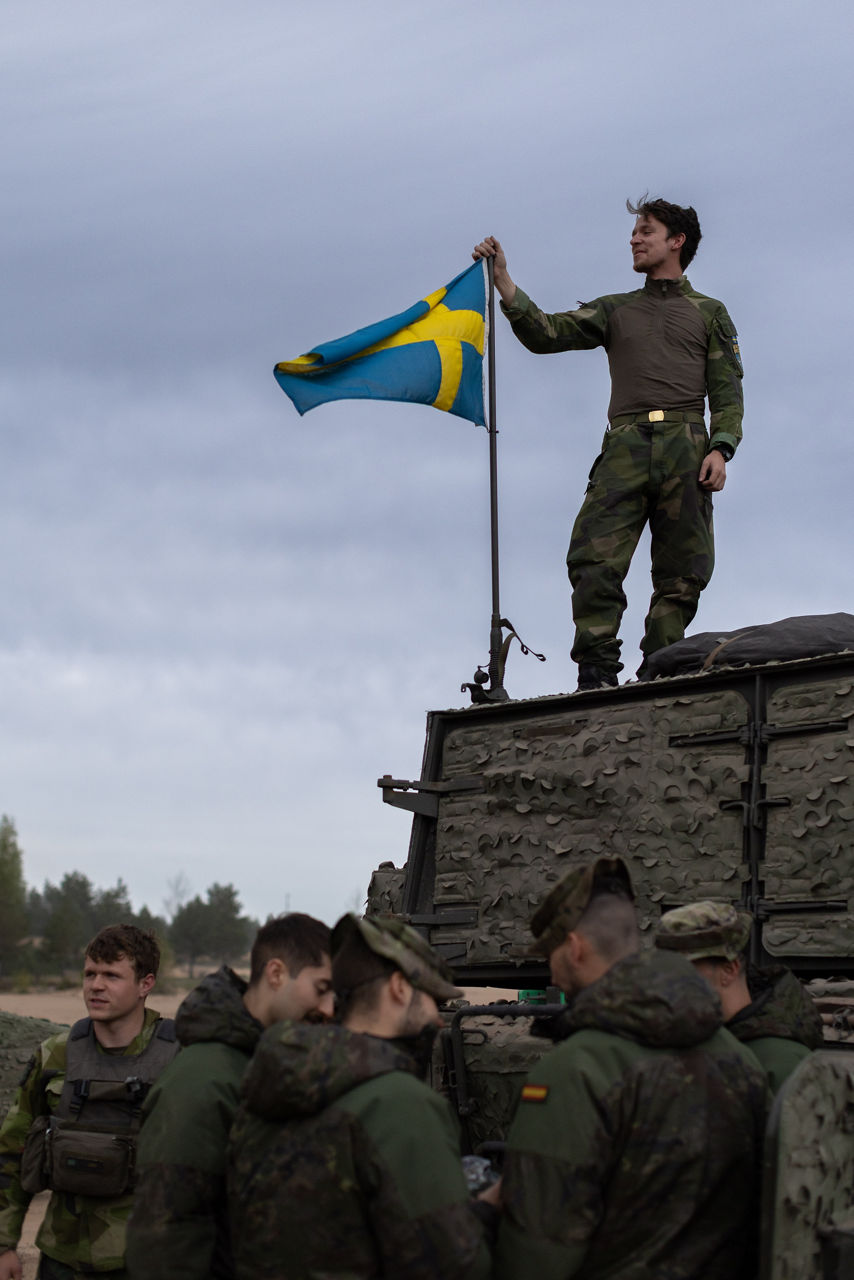 A Swedish Army soldier from the South Skåne Regiment stands with Spanish Army soldiers at Camp Ādaži in Latvia during exercise Aurora 26. Past iterations of Aurora, Swedish-led military exercise series, focused on mobilising the country’s armed forces for national defence, this year’s iteration also set out to test Sweden’s ability to incorporate Allied forces in those plans. Part of the exercise saw an armoured battalion from the South Skåne Regiment deploy to Latvia for training, while using the same transportation and logistics methods that might be used to reinforce NATO Allies in times of crisis. More than 18,000 soldiers from 13 countries participated.
