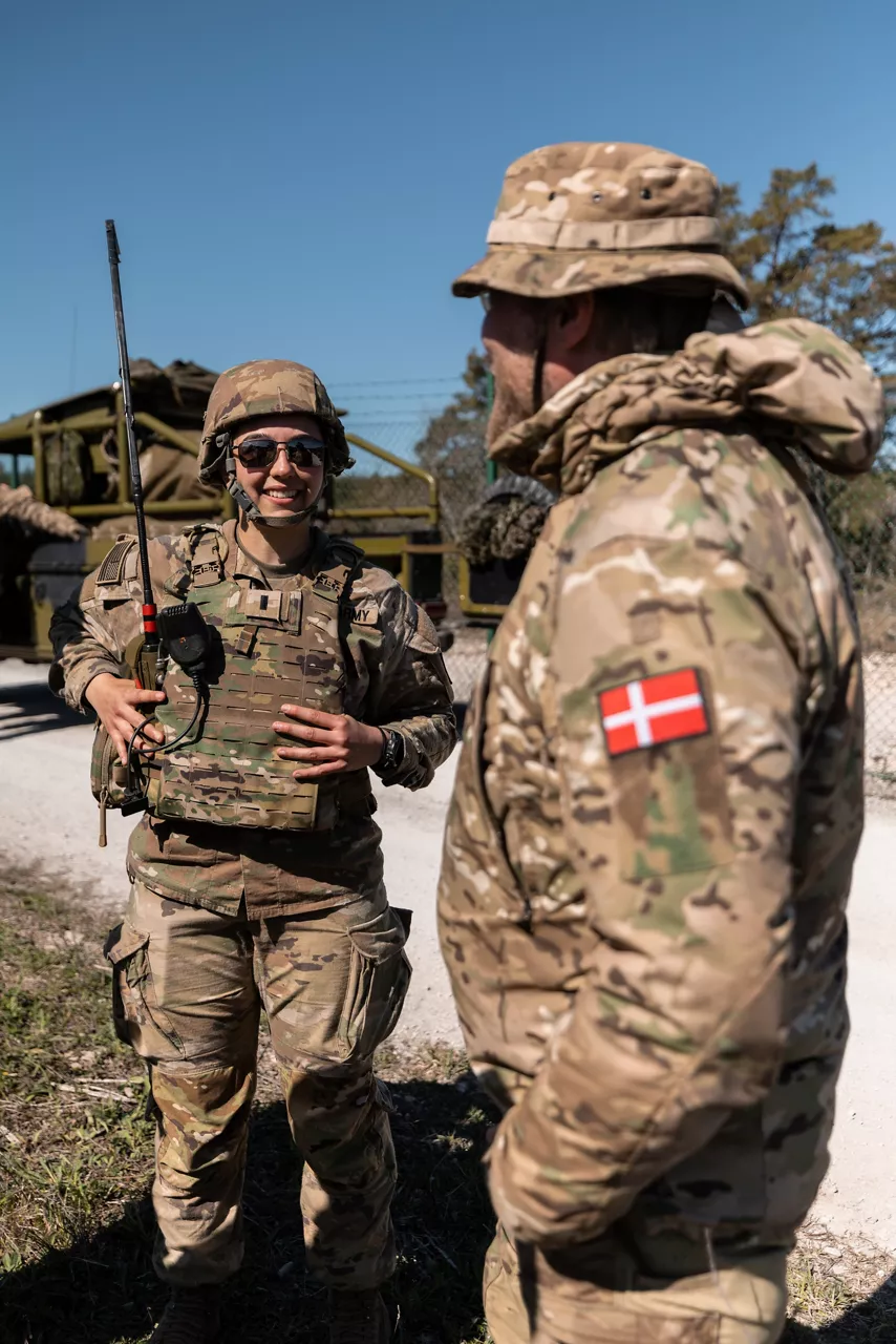 A US Army air defence officer talks with a Danish Home Guard soldier prior to moving out on a training mission on Gotland Island in Sweden during Exercise Aurora 26. Past iterations of Aurora, Swedish-led military exercise series, focused on mobilising the country’s armed forces for national defence, this year’s iteration also set out to test Sweden’s ability to incorporate Allied forces in those plans. More than 18,000 soldiers from 13 countries participated.