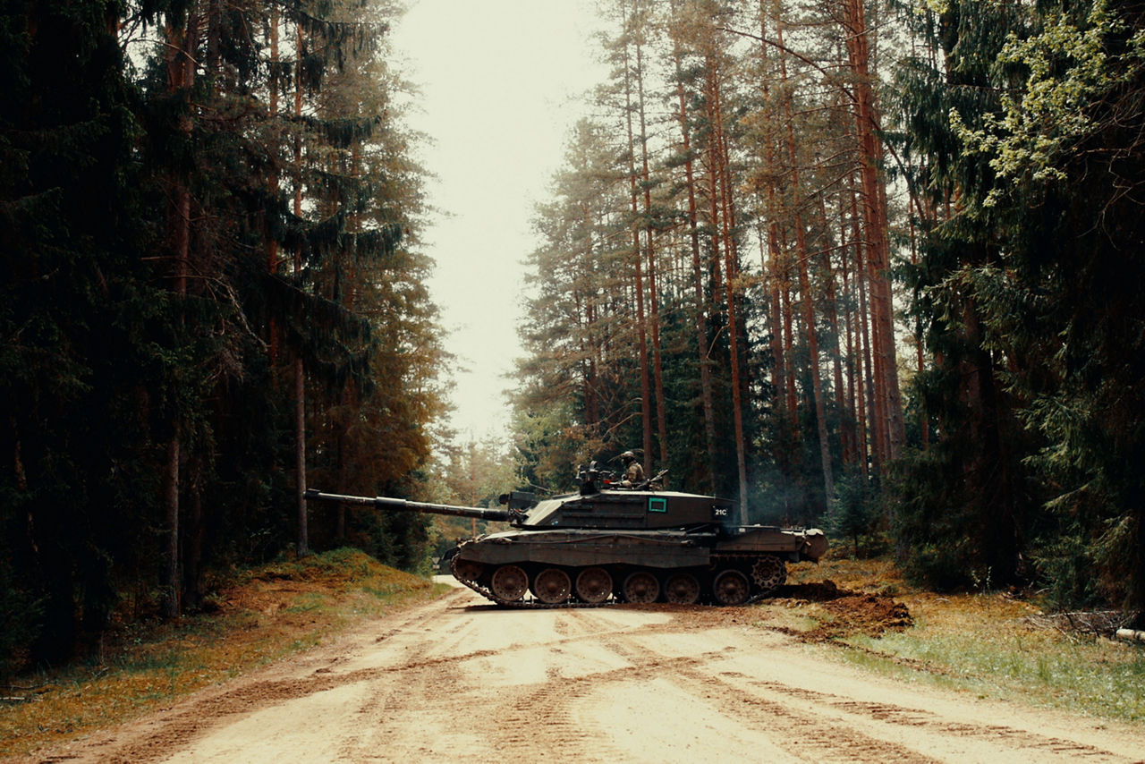 A British Army Challenger 2 Main Battle Tank crosses a dirt road in southern Estonia during Exercise Spring Storm 26. Spring Storm is the largest annual exercise of the Estonian Defence Forces, testing the leadership and combat readiness of the Estonian Army, Air Force, Navy and Cyber Command, as well as the Estonian Defence League. Forces from NATO's multinational battlegroup in Estonia also participated, ensuring that, should Estonia need to defend its territory, its troops will be ready to seamlessly integrate Allied combat power. Spring Storm 26 took place throughout Estonia and in northern Latvia from 4 May to 1 June 2026.