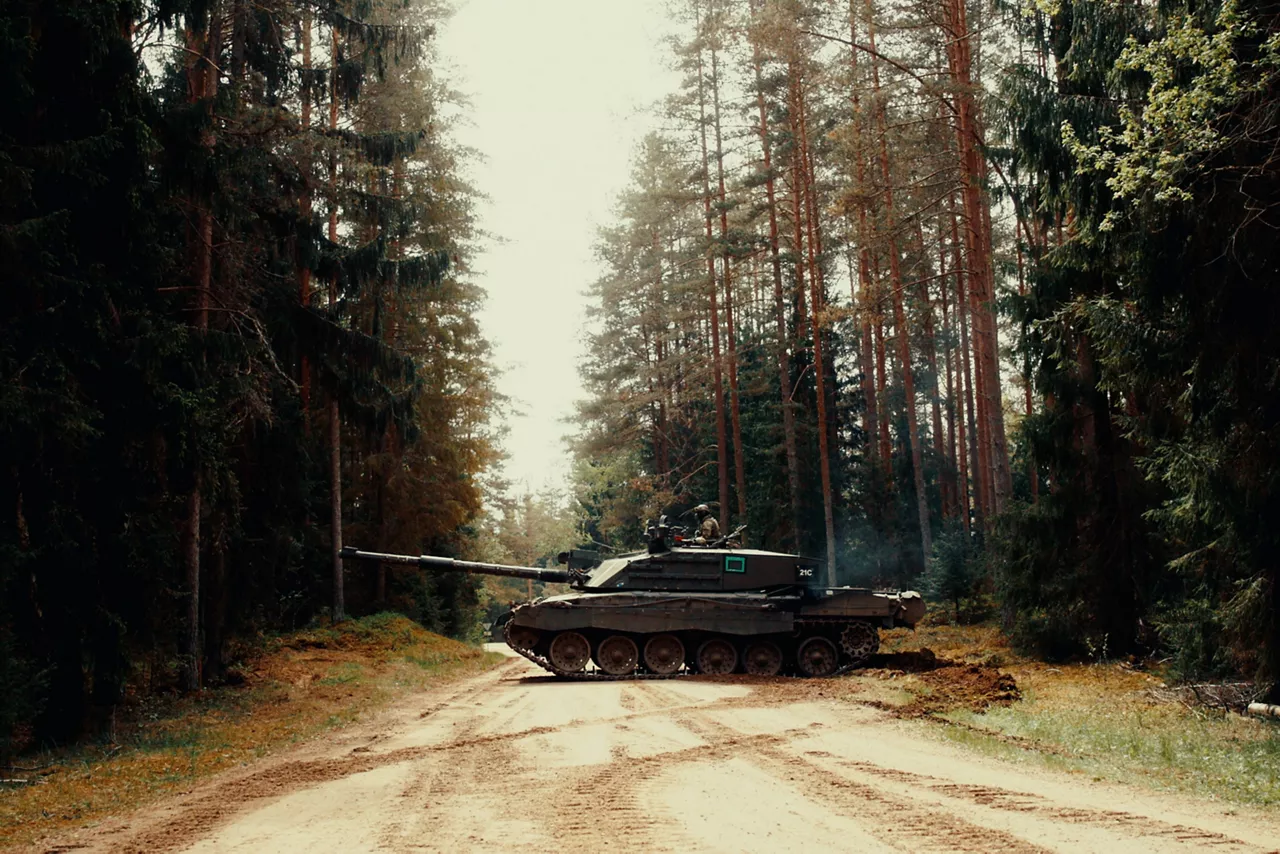 A British Army Challenger 2 Main Battle Tank crosses a dirt road in southern Estonia during Exercise Spring Storm 26. Spring Storm is the largest annual exercise of the Estonian Defence Forces, testing the leadership and combat readiness of the Estonian Army, Air Force, Navy and Cyber Command, as well as the Estonian Defence League. Forces from NATO's multinational battlegroup in Estonia also participated, ensuring that, should Estonia need to defend its territory, its troops will be ready to seamlessly integrate Allied combat power. Spring Storm 26 took place throughout Estonia and in northern Latvia from 4 May to 1 June 2026.
