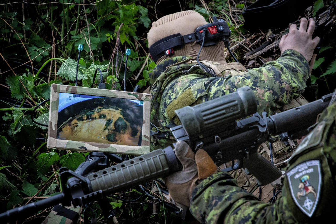 A Canadian drone pilot operating an FPV drone using goggles and a field monitor. NATO’s Multinational Brigade in Latvia regularly runs training exercises where troops integrate drones of all kinds, making sure Allied forces keep pace with innovations in modern wafare.