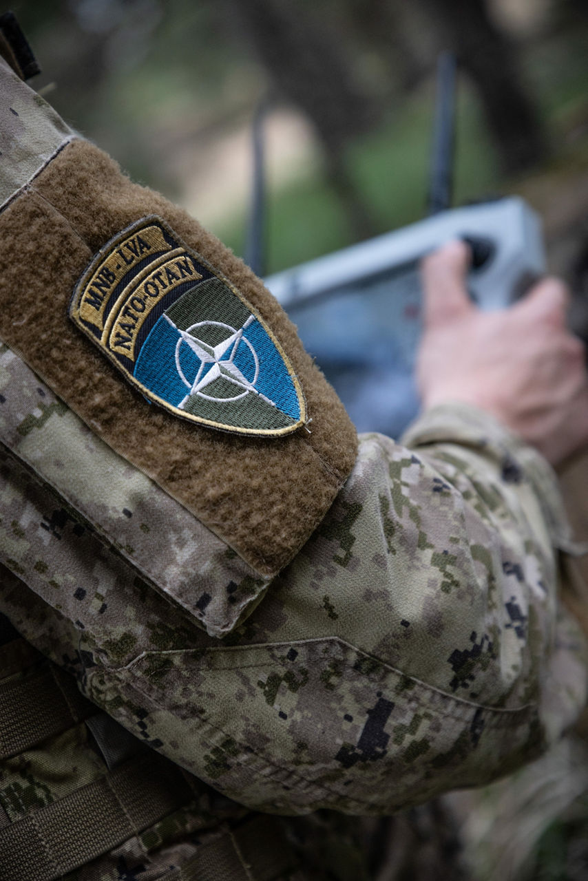 The NATO Multinational Battlegroup Latvia patch on a drone controller. NATO’s Multinational Brigade in Latvia regularly runs training exercises where troops integrate all kinds of drones, making sure Allied forces keep up with innovations in modern warfare.