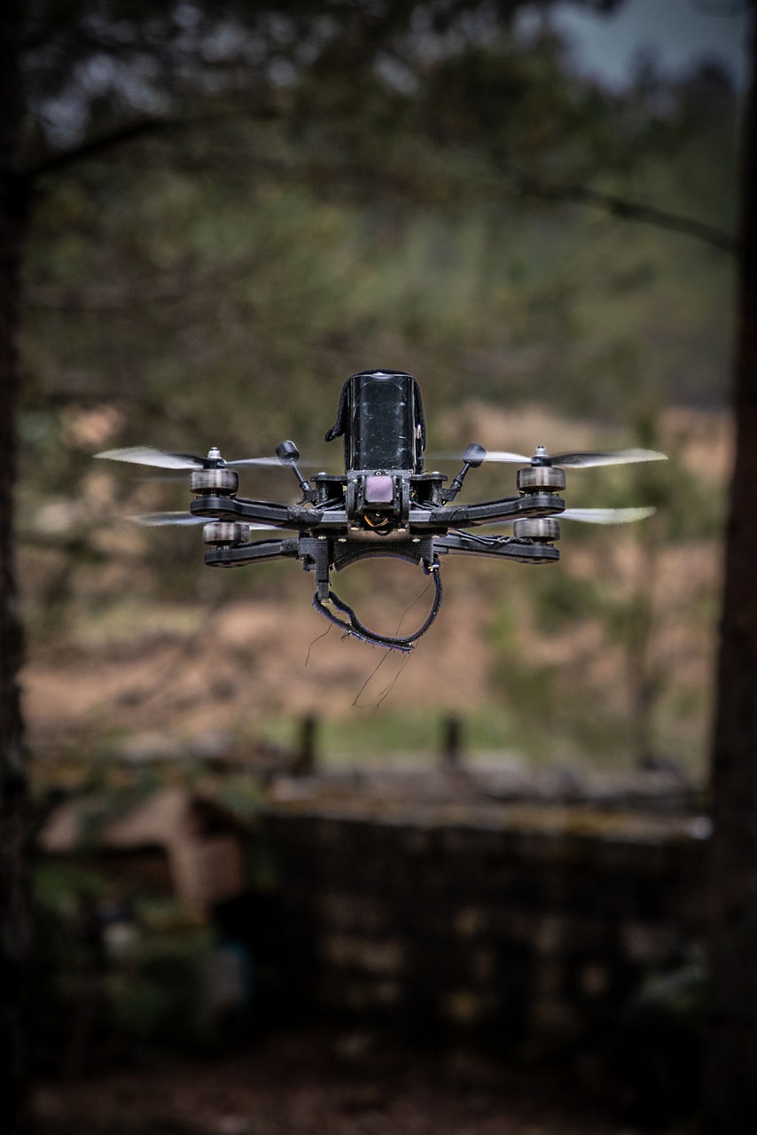 A FPV drone hovering in the forest. NATO’s Multinational Brigade in Latvia regularly runs training exercises where troops integrate all kinds of drones, making sure Allied forces keep up with innovations in modern warfare.