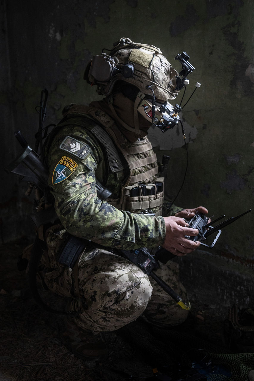 A Canadian Armed Forces drone pilot operating an FPV drone. NATO’s Multinational Brigade in Latvia regularly runs training exercises where troops integrate all kinds of drones, making sure Allied forces keep up with innovations in modern warfare.