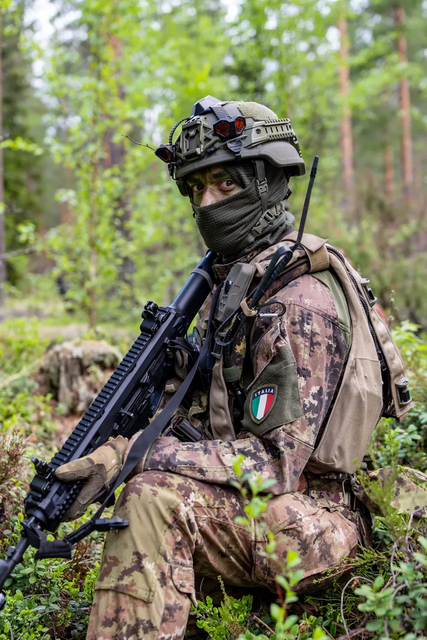 An Italian soldier looks directly at the camera while securing the area during a simulated battle.

Exercise Northern Star 26 brings together more than 5,000 troops from seven NATO Allies – Finland, France, Hungary, Italy, Poland, the United Kingdom and the United States for joint training in the forests of Kainuu, Finland. Soldiers train side by side in dense terrain, combining air and ground operations as Chinook helicopters insert troops into landing zones, while armoured units manoeuvre and infantry advance through the forest to engage in simulated combat. For many Finnish conscripts, this marks the final and most demanding phase of their military service, testing skills developed throughout their training. Working together in these conditions helps Allied forces strengthen coordination and improve how they operate together in harsh terrain. The exercise runs from 18 to 30 May 2026.