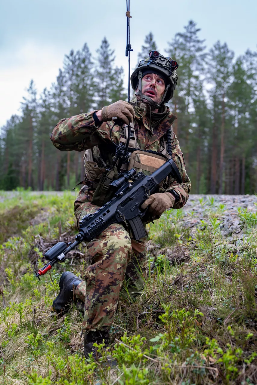 An Italian soldier adjusts a radio antenna during a simulated battle.

Exercise Northern Star 26 brings together more than 5,000 troops from seven NATO Allies – Finland, France, Hungary, Italy, Poland, the United Kingdom and the United States for joint training in the forests of Kainuu, Finland. Soldiers train side by side in dense terrain, combining air and ground operations as Chinook helicopters insert troops into landing zones, while armoured units manoeuvre and infantry advance through the forest to engage in simulated combat. For many Finnish conscripts, this marks the final and most demanding phase of their military service, testing skills developed throughout their training. Working together in these conditions helps Allied forces strengthen coordination and improve how they operate together in harsh terrain. The exercise runs from 18 to 30 May 2026.