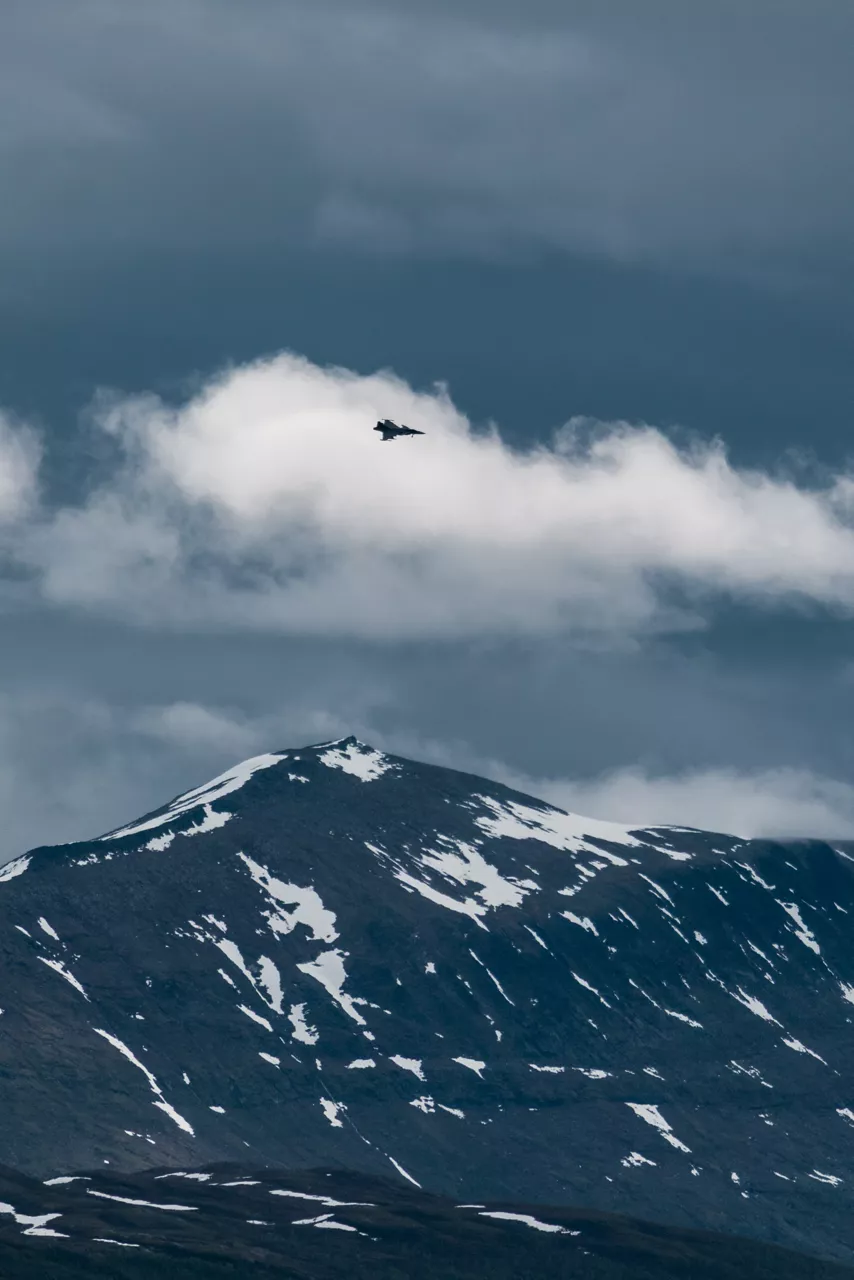 A Swedish Air Force JAS 39 Gripen cuts through the clouds as it prepares to land at Bardufoss Air Station in Norway during exercise Ramstein Flag 26. This year’s iteration of NATO's annual large-scale exercise involved 18 nations flying more than 200 aircraft from 20 different locations across Europe, including several air bases in the High North. The Swedish Air Force sent a detachment of Gripens to Air Station Bardufoss, where Norway has brought a Cold War-era bunker-hangar complex back into use after roughly four decades of dormancy.
