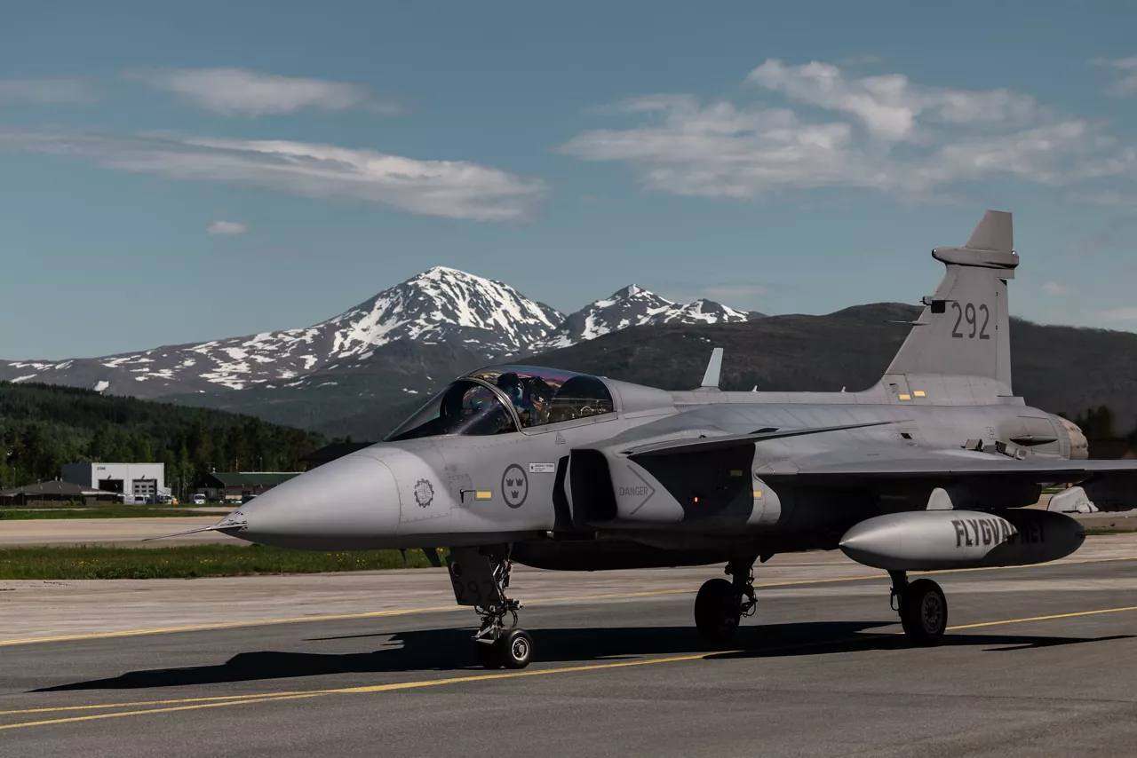 A Swedish Air Force JAS 39 Gripen taxis back to its parking position at Bardufoss Air Station in Norway during exercise Ramstein Flag 26. This year’s iteration of NATO's annual large-scale exercise involved 18 nations flying more than 200 aircraft from 20 different locations across Europe, including several air bases in the High North. The Swedish Air Force sent a detachment of Gripens to Air Station Bardufoss, where Norway has brought a Cold War-era bunker-hangar complex back into use after roughly four decades of dormancy.