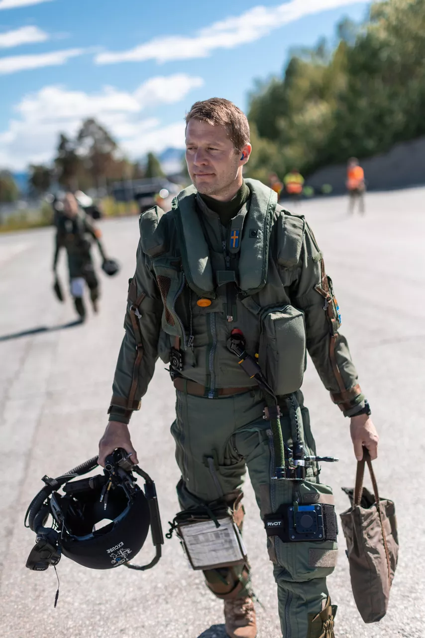 Lieutenant Colonel Erik, leader of a detachment of Swedish Air Force JAS 39 Gripens for exercise Ramstein Flag 26, walks out to his fighter jet at Bardufoss Air Station in Norway. This year’s iteration of NATO's annual large-scale exercise involved 18 nations flying more than 200 aircraft from 20 different locations across Europe, including several air bases in the High North. The Swedish Air Force sent a detachment of Gripens to Air Station Bardufoss, where Norway has brought a Cold War-era bunker-hangar complex back into use after roughly four decades of dormancy.