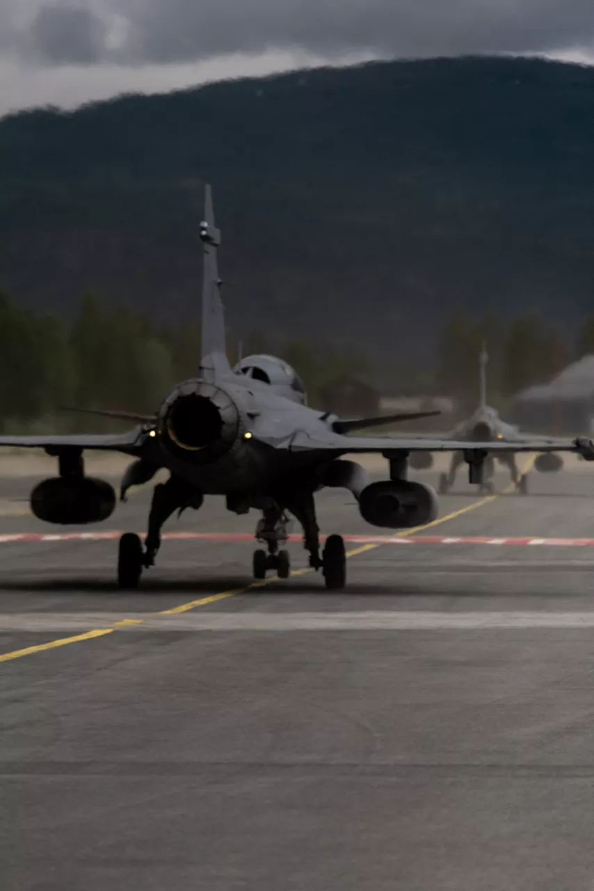 Swedish Air Force JAS 39 Gripen fighters taxi for takeoff at Bardufoss Air Station in Norway during exercise Ramstein Flag 26. This year’s iteration of NATO's annual large-scale exercise involved 18 nations flying more than 200 aircraft from 20 different locations across Europe, including several air bases in the High North. The Swedish Air Force sent a detachment of Gripens to Air Station Bardufoss, where Norway has brought a Cold War-era bunker-hangar complex back into use after roughly four decades of dormancy.