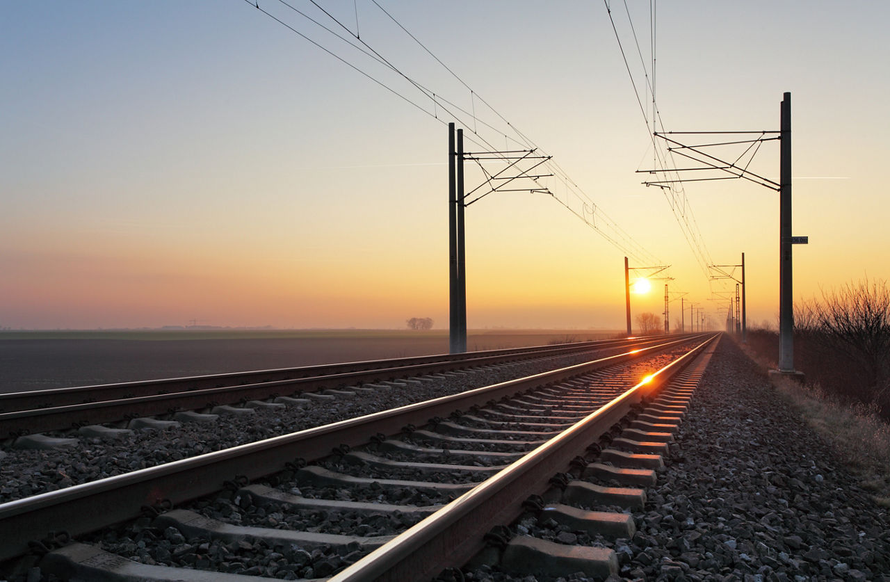 Railroad - Railway at sunset with sun