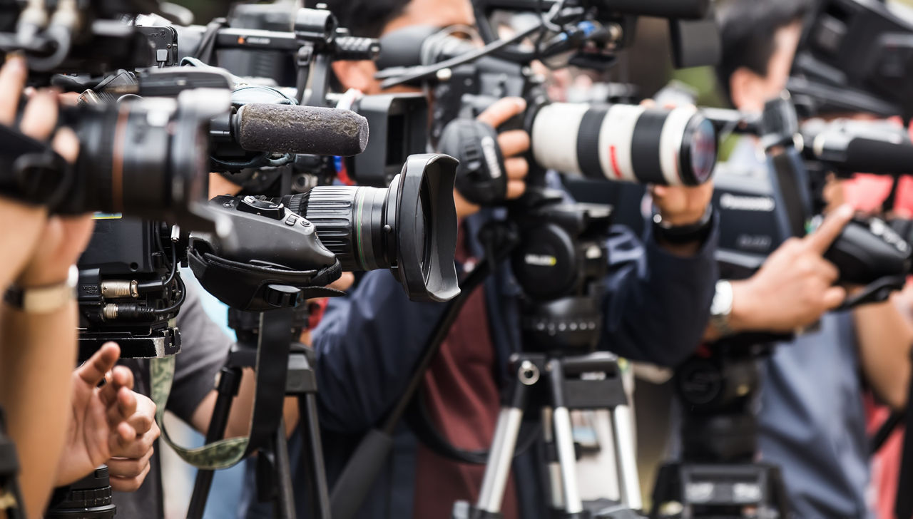 Video camera operator working with his professional equipment 
