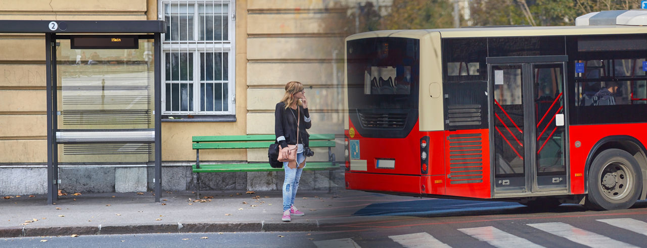 Young caucasian woman waiting for a public transportation on a station.