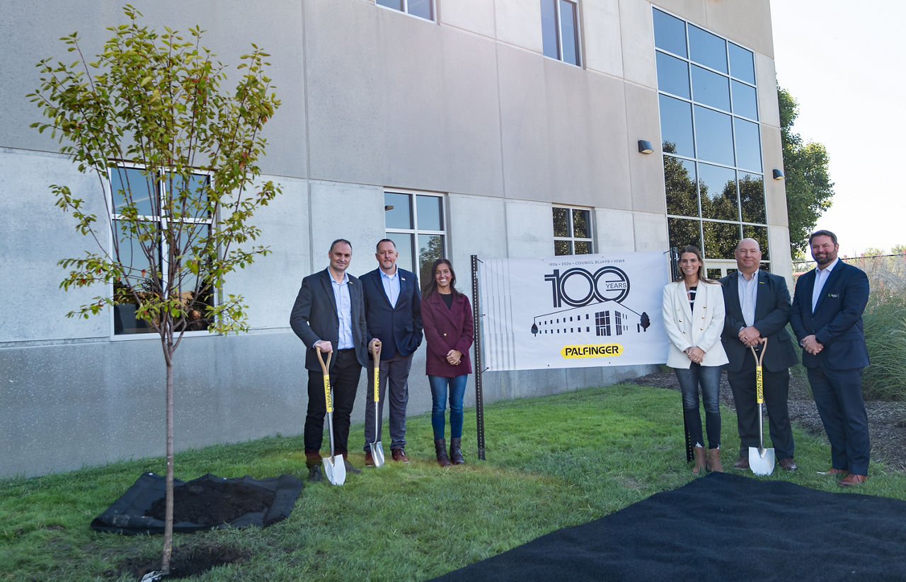  PALFINGER marked 100 years of work-truck manufacturing rooted in Omaha Standard with a tree-planting ceremony at its Council Bluffs, Iowa, facility, where service cranes and crane bodies are produced. Pictured from left are: Ismael Daneluz, President of PALFINGER North America; James Bates, Senior Operations Manager, PALFINGER North America; Dr. Cara Trede, Executive Director of Career EdVantage; Bailey Mcqueen, Senior Director of Strategy, Career EdVantage; Jason Holt, Vice President of Operations, PALFINGER North America; Chris LaFerla, President & CEO, Council Bluffs Area Chamber of Commerce.
