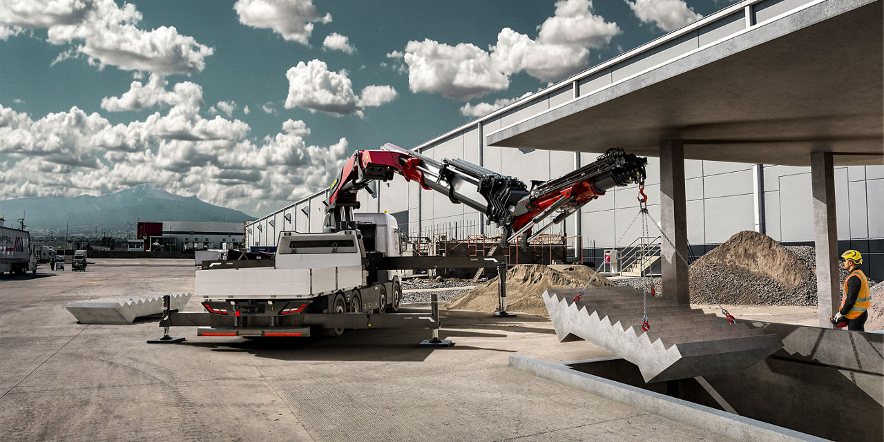 A truck-mounted PALFINGER crane lifting a large precast concrete stair section into place at a construction site, with a worker guiding the load.and interacting with a digital network visualization, set against the backdrop of a city skyline at night, symbolizing innovation and connectivity.