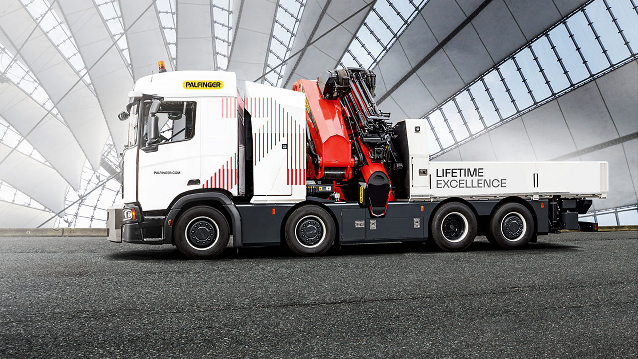 A PALFINGER branded truck with a loader crane