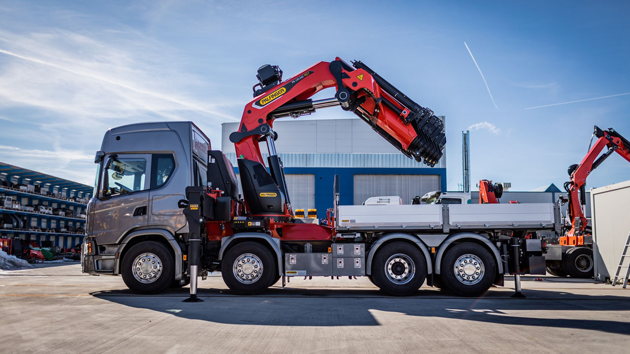 Palfinger loader crane mounted on a grey truck