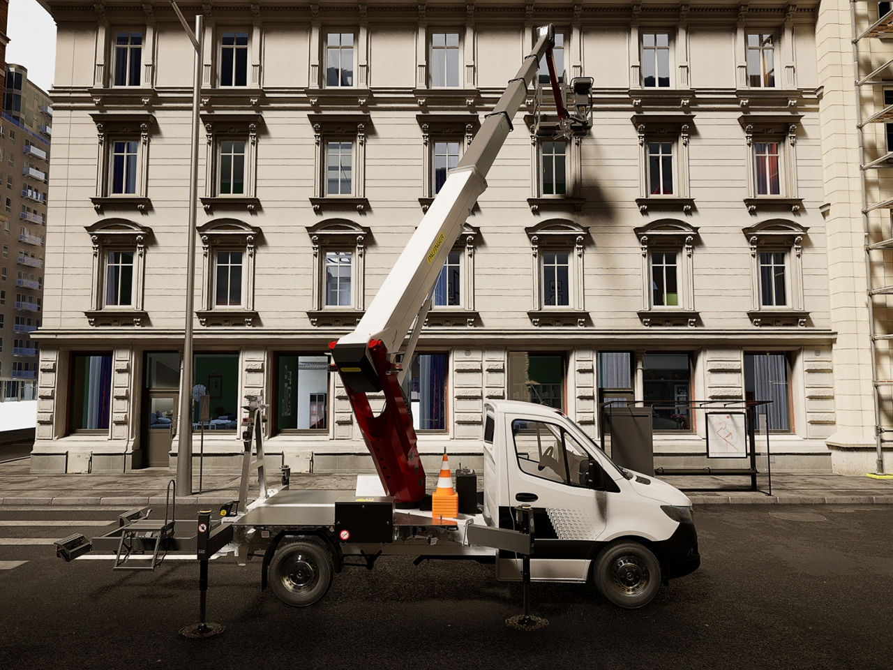 Side view of a truck-mounted lift parked along the street, with the boom raised vertically beside the building.