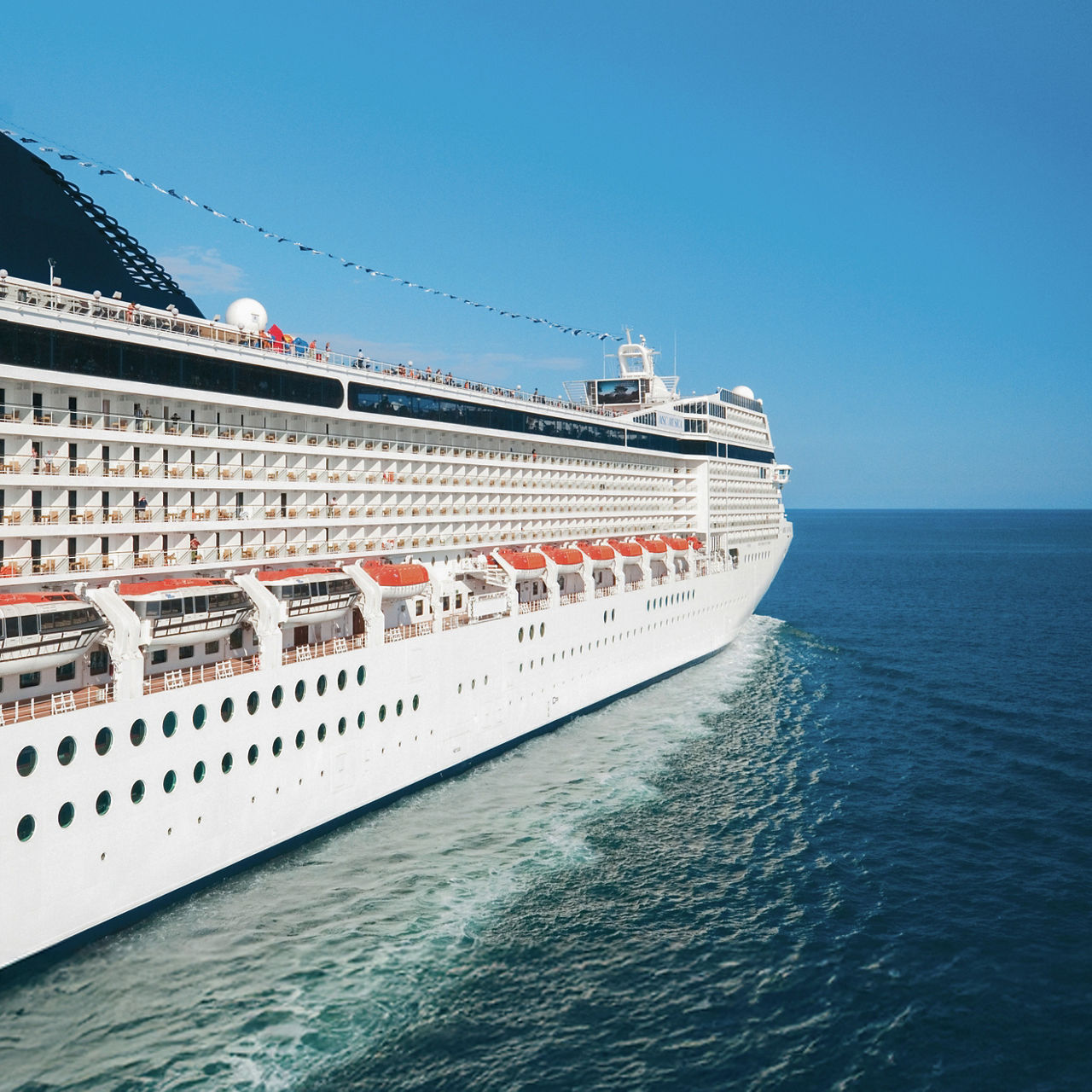 Cruise ship with lifeboats, tender boat, and davits