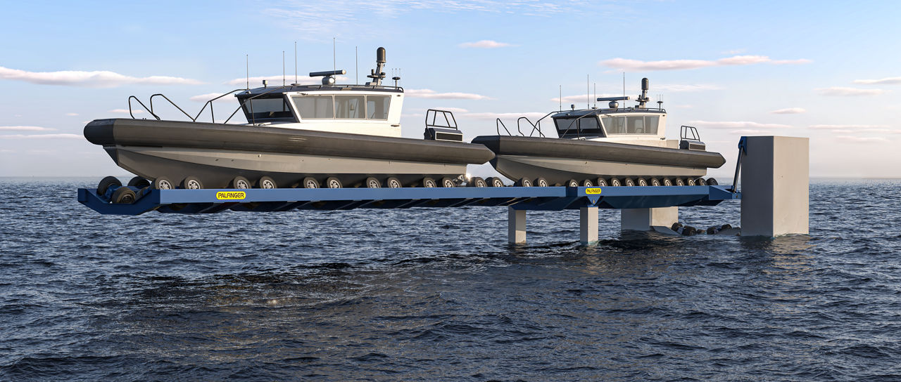 Boat #1 in the parking position on the parking cradle, and Boat #2 in the elevated parking position on the slipway cradle.