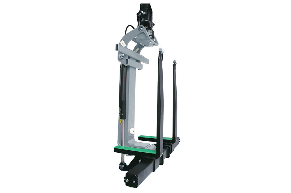 PALFINGER reversible fork attachment for loader cranes, shown as an isolated product view on white background, featuring a gray and black steel frame with green-tipped fork tines and a hydraulic rotator head at the top.