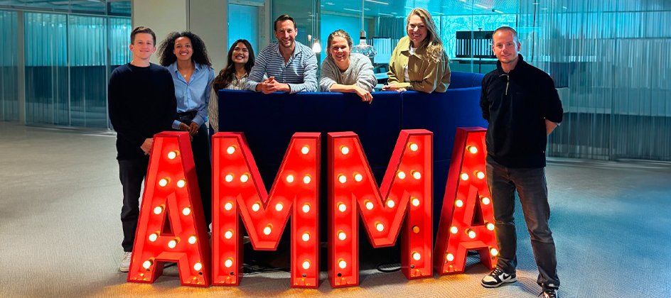 Group of Jury members standing behind the AMMA logo