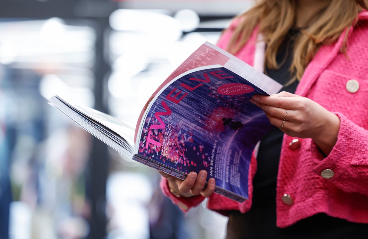 woman opening the magazine twelve