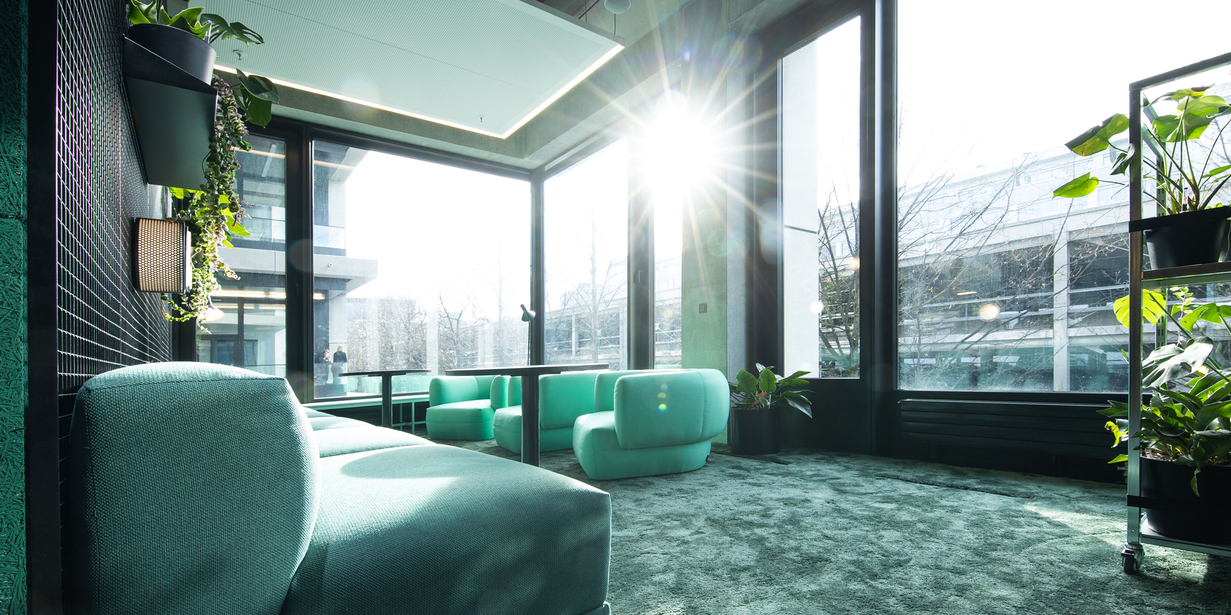 The green lounge area in the house of communication