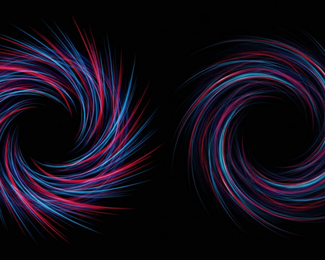 Two swirling shapes made of red and blue light trails on a black background.