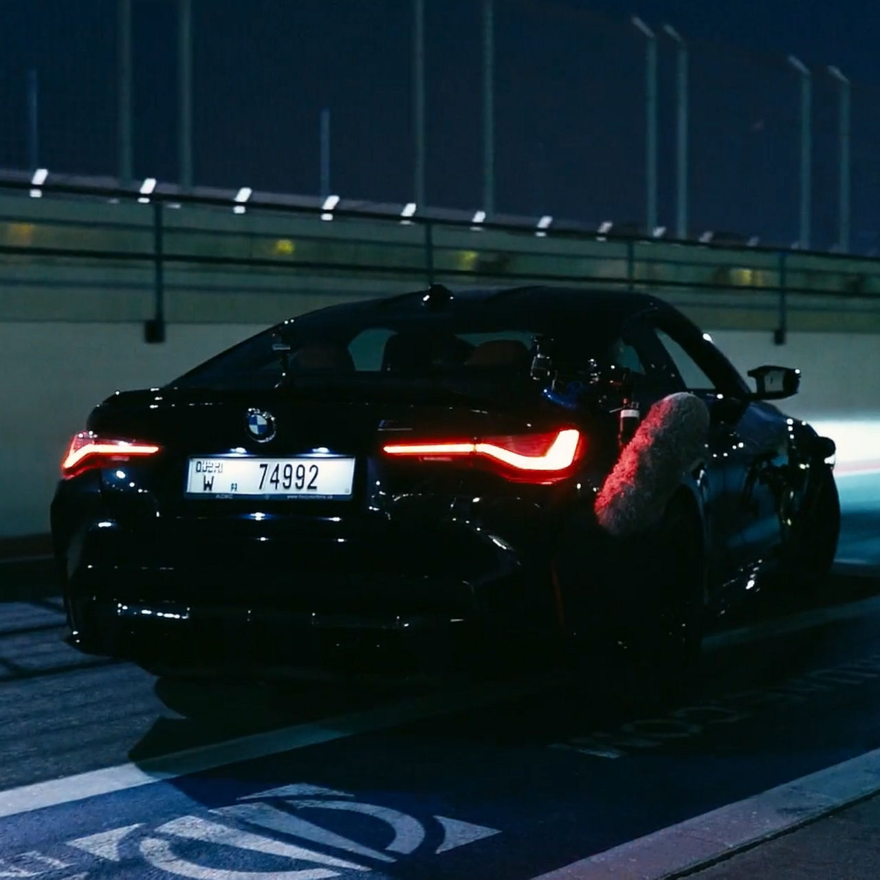 BMW car driving on the road with a recording device 