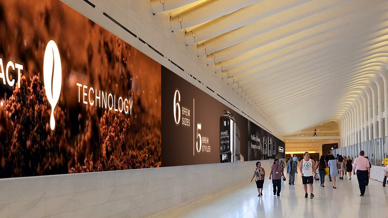 Image of De'Longhi ads on the wall of a tunnel