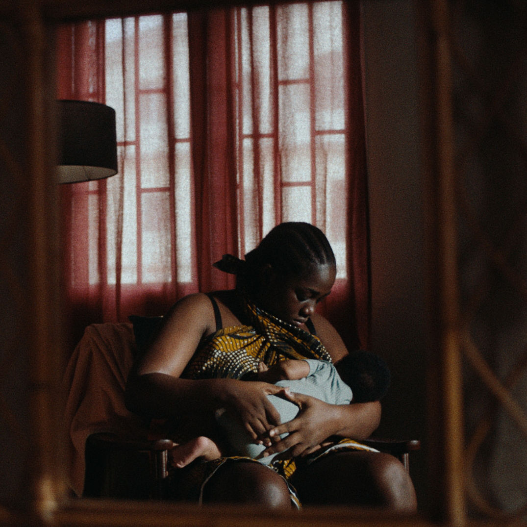 Herconomy - Breastmilk money - woman breastfeeding baby