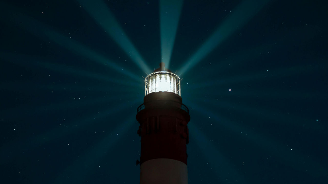 Lighthouse in dark sky