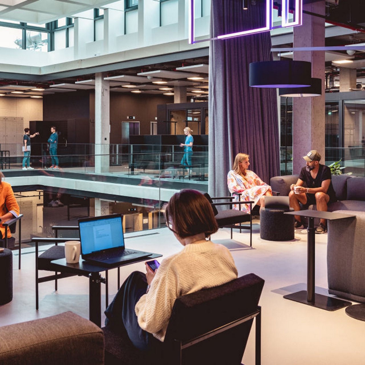 people sitting together in a co-working space