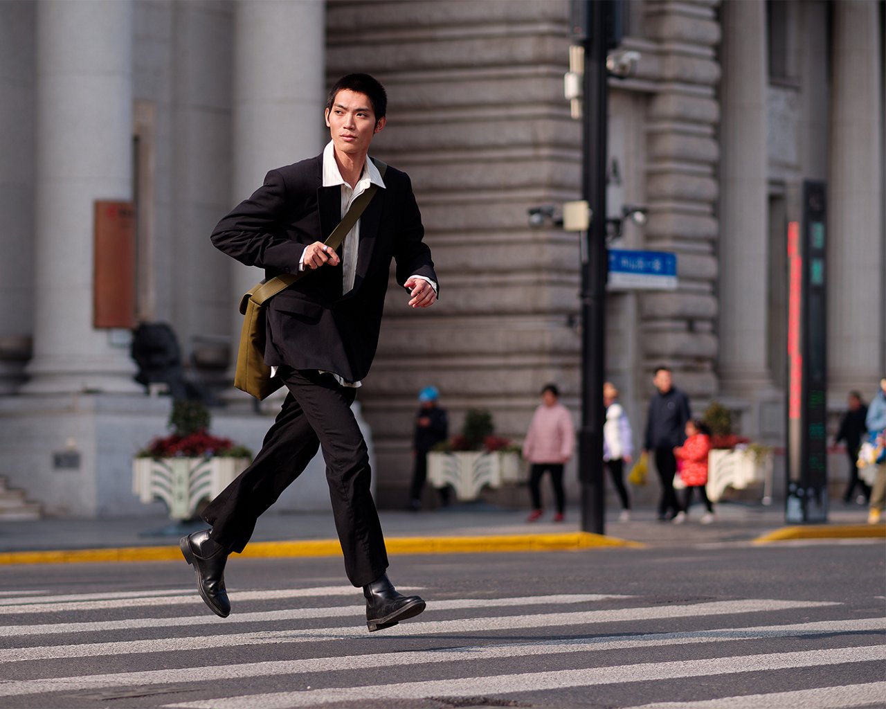 a man running over a street