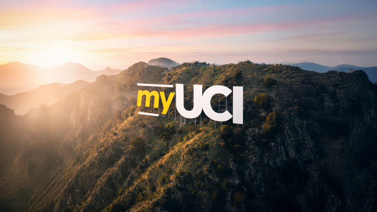 logo my uci su montagne verdi al tramonto