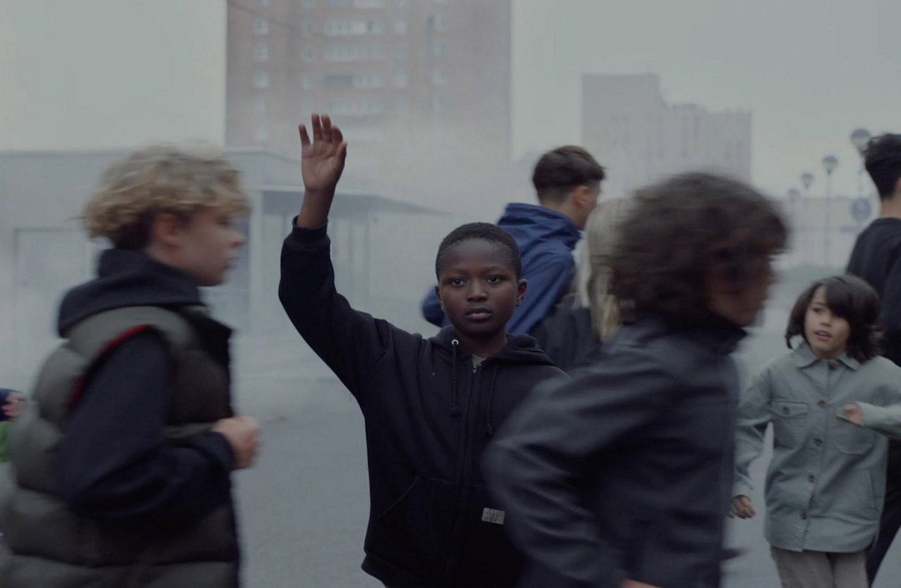 PENNY - The Kids - Scene from the commercial film as a boy stops in the crowd of running children and raises his hand