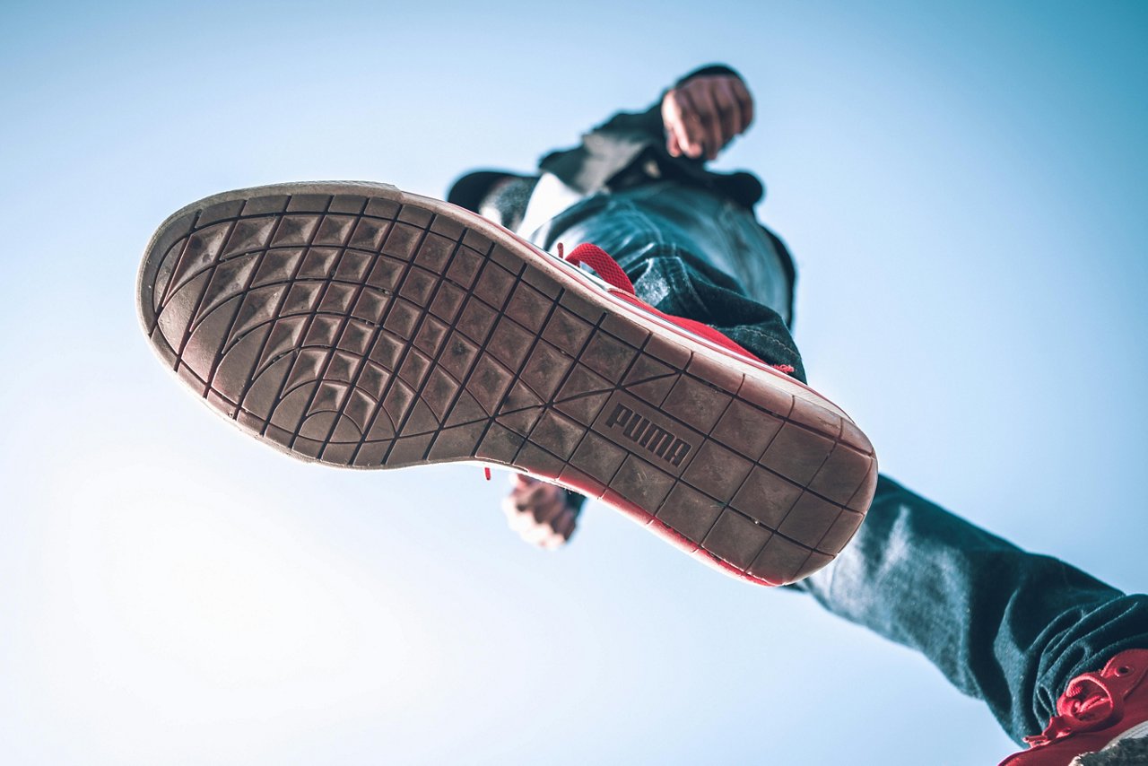 person with sneaker from below