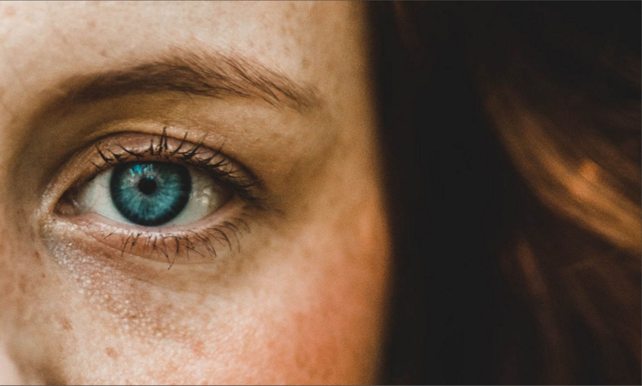 A blue eye from a woman