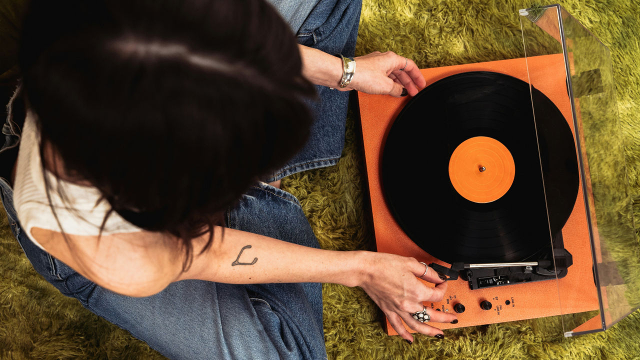 Woman using a vinyl player