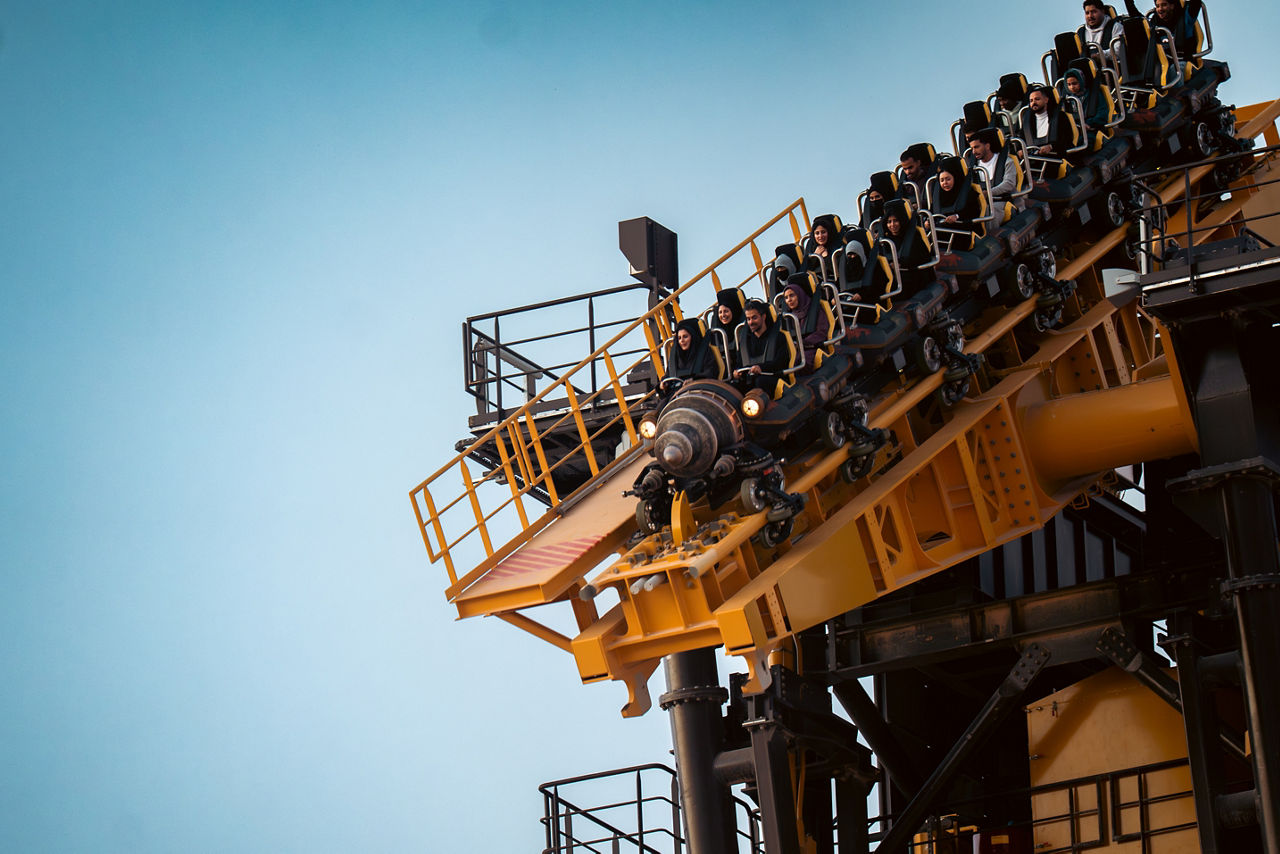 Thrill seekers experiencing high-speed roller coaster at Six Flags Qiddiya City