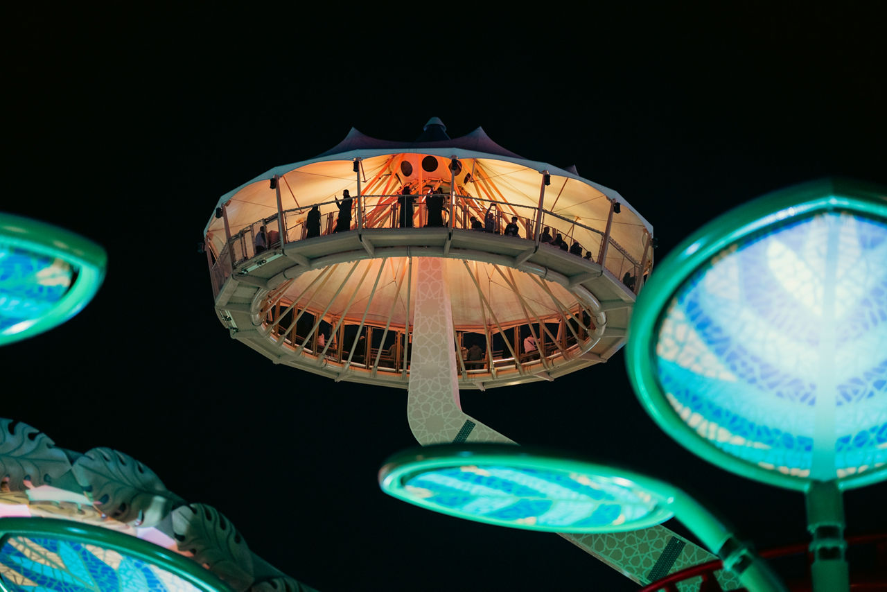 Visitors on Sky Watch enjoying panoramic night views at six flags qiddiya city