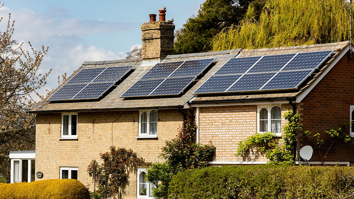A countryside house in Woodbridge, Suffolk, that has had solar panels installed on the roof to produce clean green renewable energy 