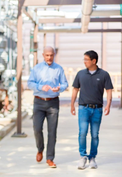 Colleagues in discussion while walking